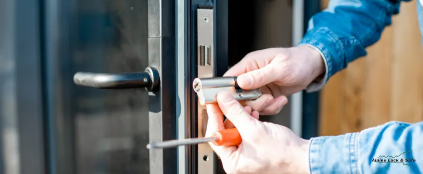 ALS - Man changing the core of a door lock
