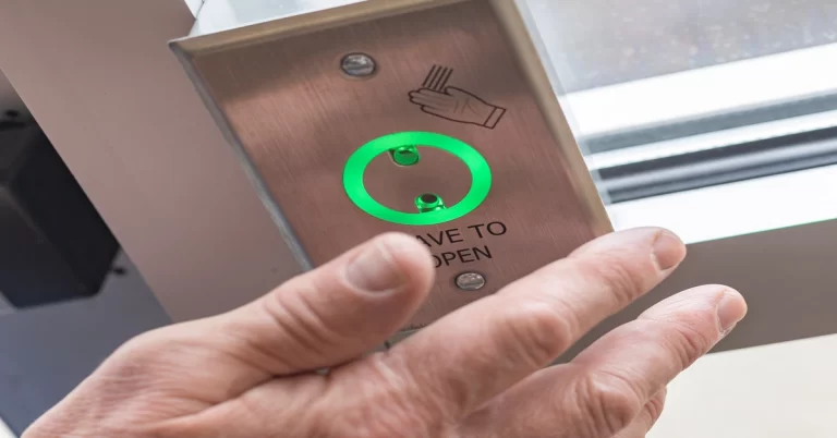 A hand opening a door lock using fingerprint